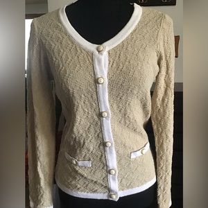 Tan cardigan with white trim and gold buttons